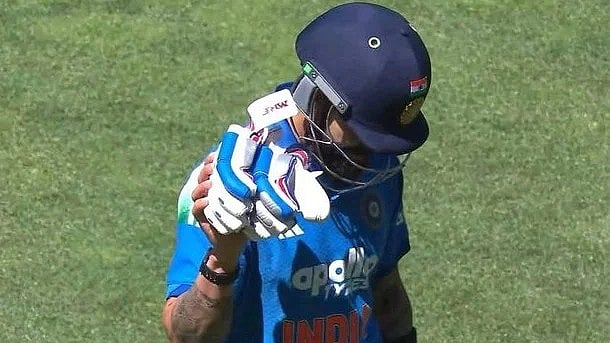 Gloves off, right hand up – did Virat Kohli hint at something?