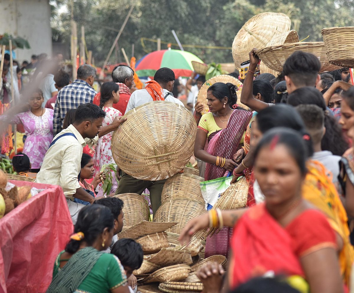 Devotees immersed in holy waters at sunrise, offering prayers to the Sun.​