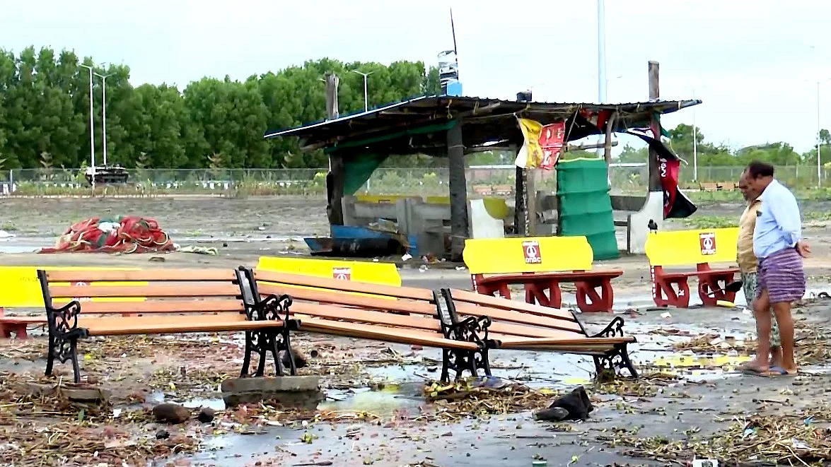 People look at damaged benches in Kakinada, Andhra Pradesh.