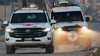Vehicles carrying the bodies of three hostages arrive in Gaza