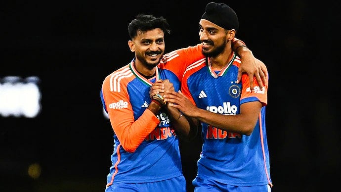 Player of the match Axar Patel (left) celebrates a wicket with Arshdeep Singh