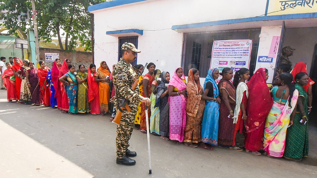 Women voters line up to cast their ballots in Bihar.