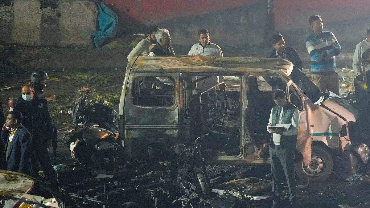 Various security agencies investigate the spot after a blast occurred in a parked car.