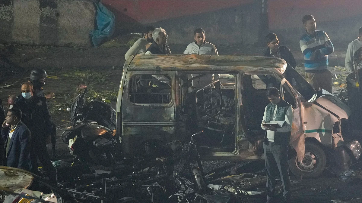 Various security agencies investigate the spot after a blast occurred in a parked car.