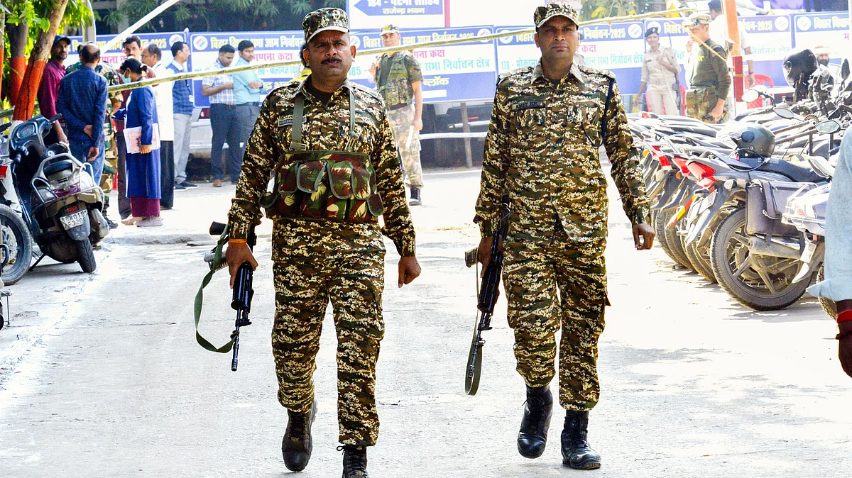 Security personnel on vigil outside a strong room where EVMs have been kept in Bihar
