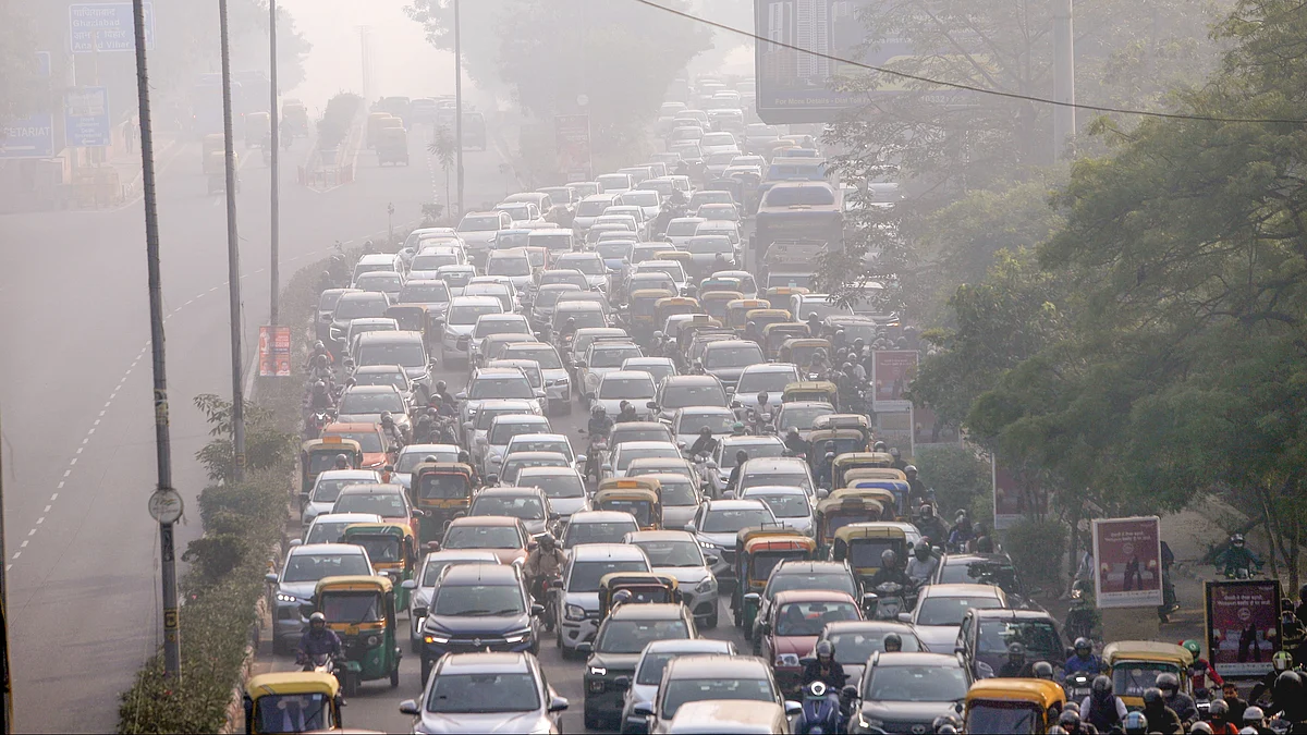 Vehicles crawl through heavy smog at ITO in New Delhi.