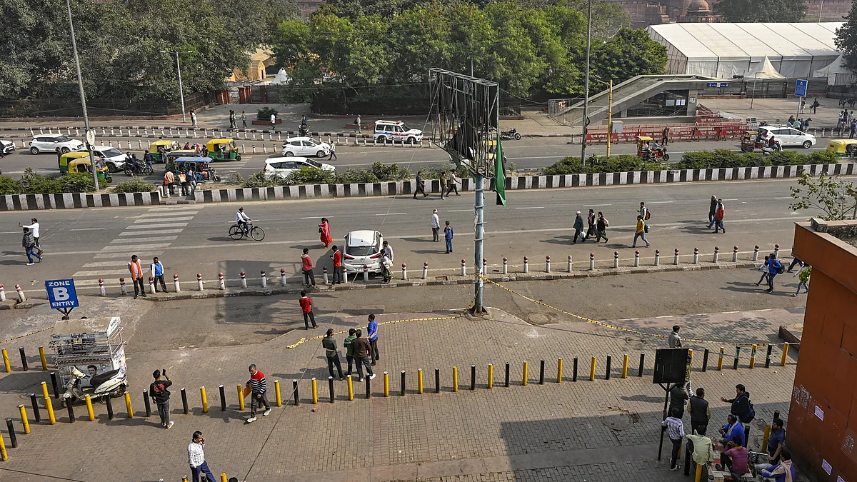 Commuters near the Red Fort days after a car blast in the area, in New Delhi.