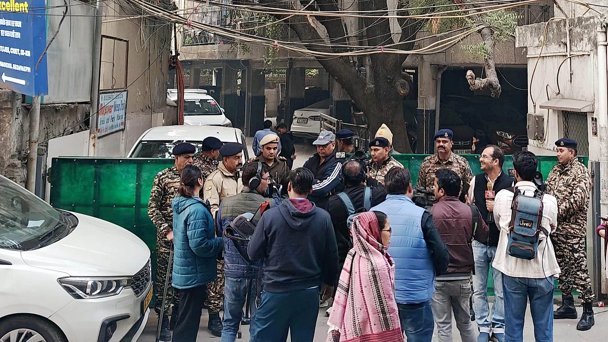 Officials outside the Delhi office of Al Falah University in Okhla during an ED raid.