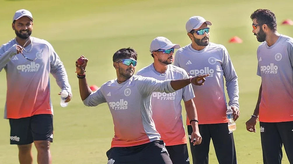 Rishabh Pant (left) with members of Indian team in practice