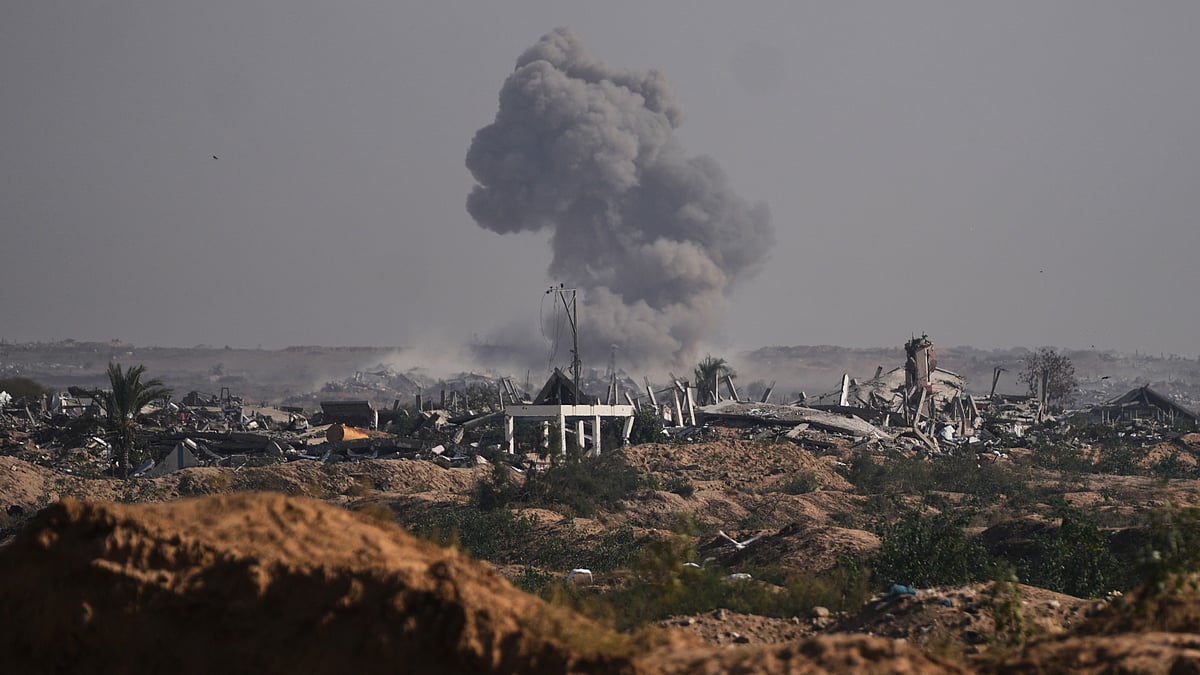 Airstrikes in Gaza leave 14 dead as Israel says attacks targeted Hamas after armed breach