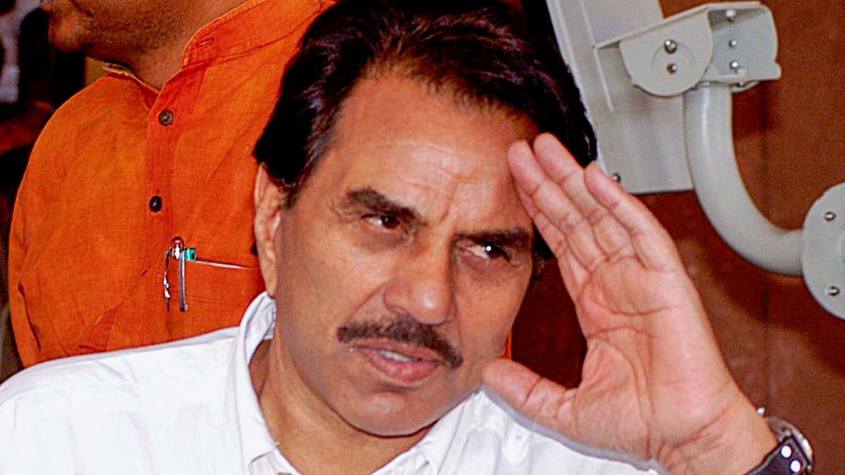 In this 19 April 2005 photo, Lok Sabha MP Dharmendra leaves Parliament