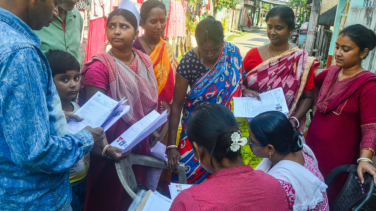BLOs check and collect enumeration forms in Siliguri.