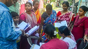 BLOs check and collect enumeration forms in Siliguri.