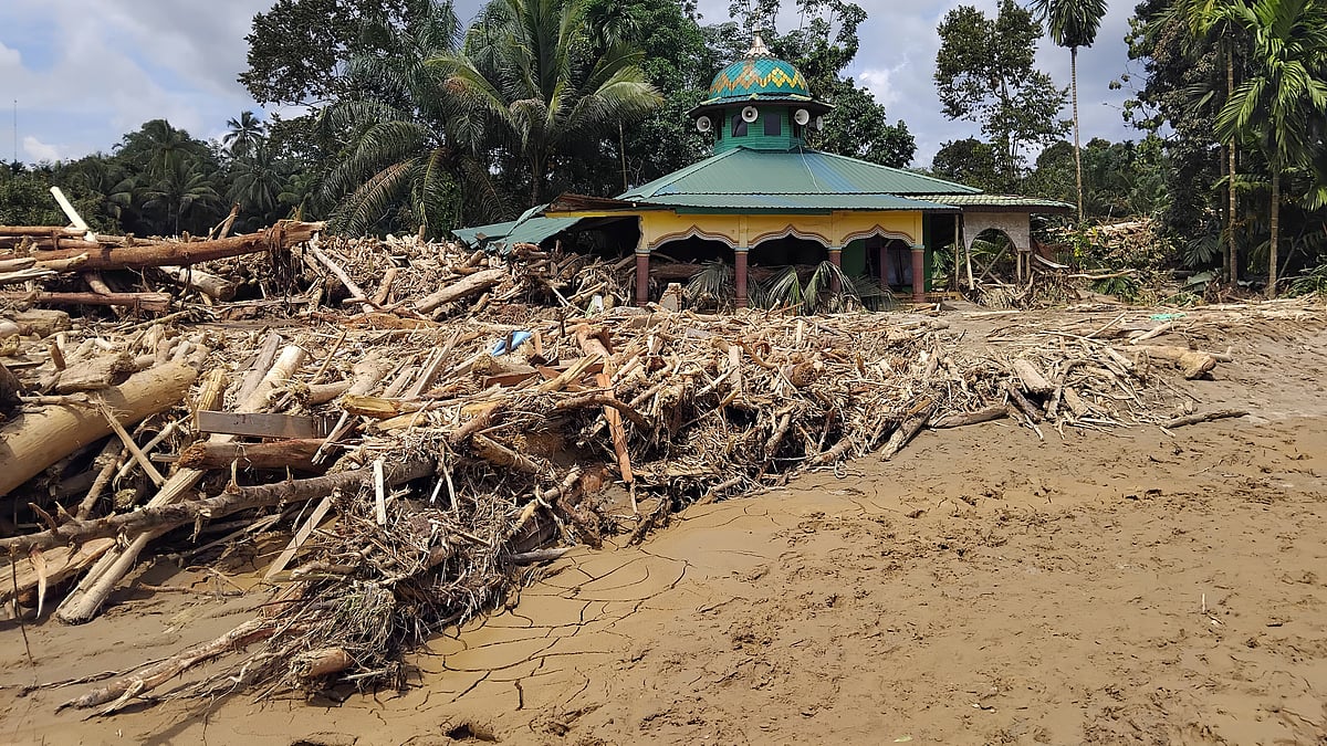 A mosque stands swamped in mud and debris after flash floods in Batang Toru, North Sumatra.