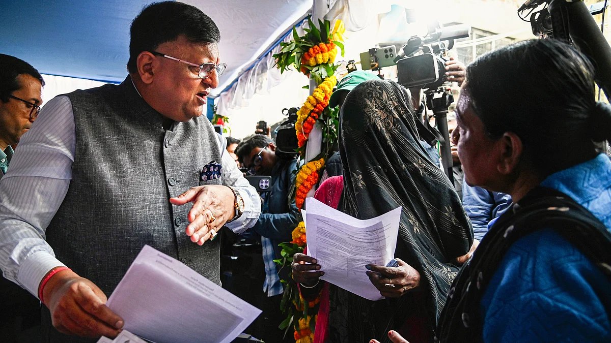 West Bengal CEO Manoj Kumar Agarwal with electors at an SIR camp, in Kolkata.