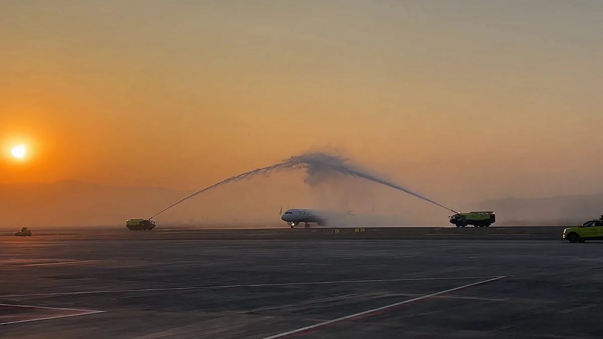 An IndiGo flight gets a water cannon salute at Navi Mumbai International Airport. (Photo: PTI)