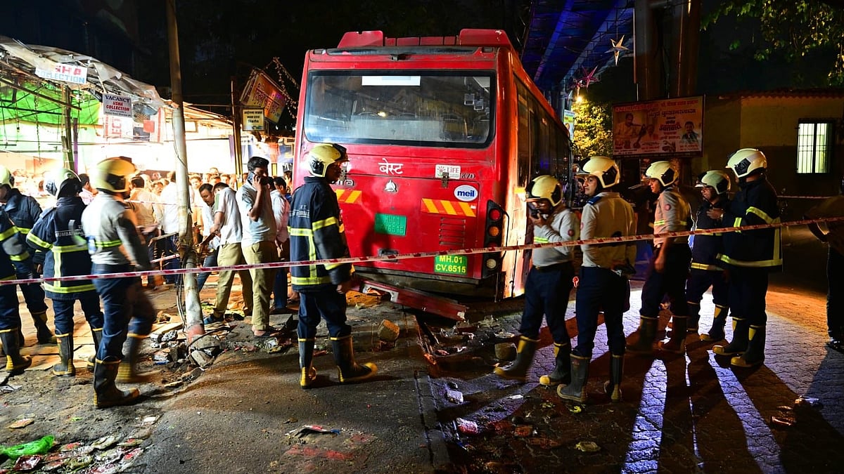 Officials inspect the site of the tragic Mumbai bus accident in Bhandup.