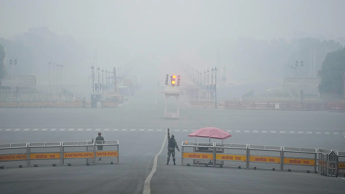 Security personnel stand guard on a foggy winter morning at Vijay Chowk, New Delhi.