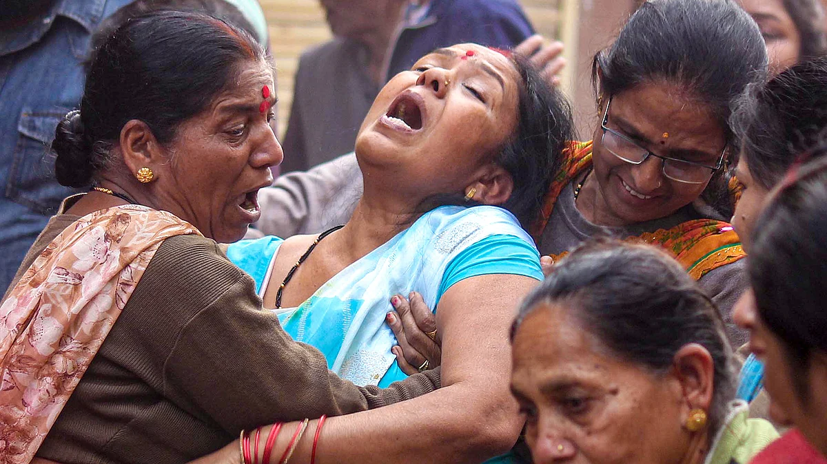 Family members of a victim, who died after consumption of allegedly contaminated water.