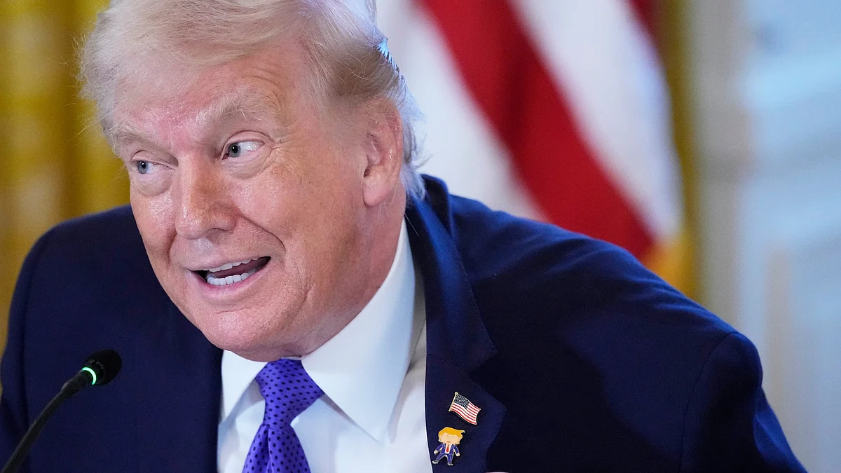 Trump sports the “Happy Trump” pin — diplomacy has a dress code