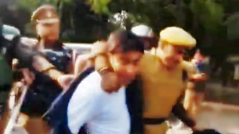 NSUI national president Varun Chaudhary being slammed on the ground by UP Police personnel 