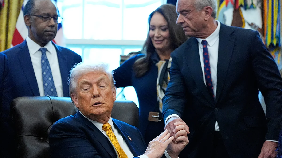 Donald Trump shakes hands with Robert F. Kennedy Jr. at White House.