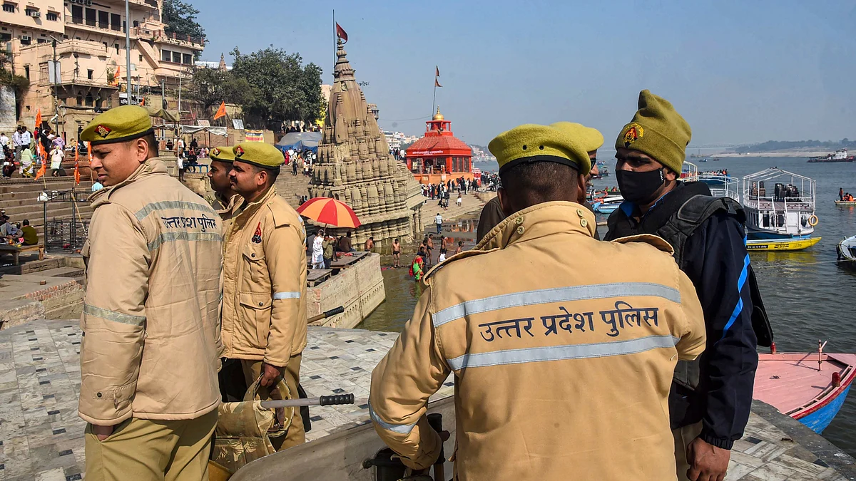 Policemen stand guard at Manikarnika Ghat