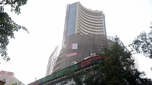 Sensex, Nifty slip into red after early gains as volatility rises