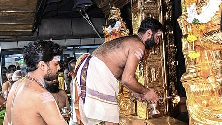Priests offering prayers at Sabarimala temple 