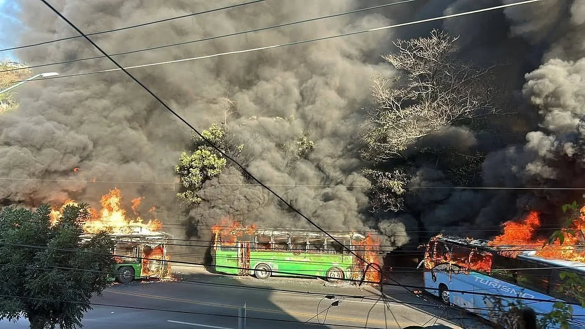 Vehicles set ablaze amid unrest in Jalisco, Mexico.