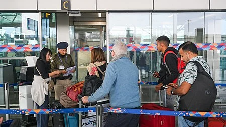 Representative image of passengers at airport security.