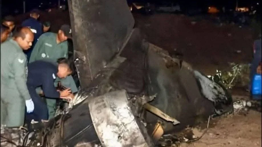 Officials inspect the crashed Sukhoi Su-30MKI fighter jet in Karbi Anglong district.