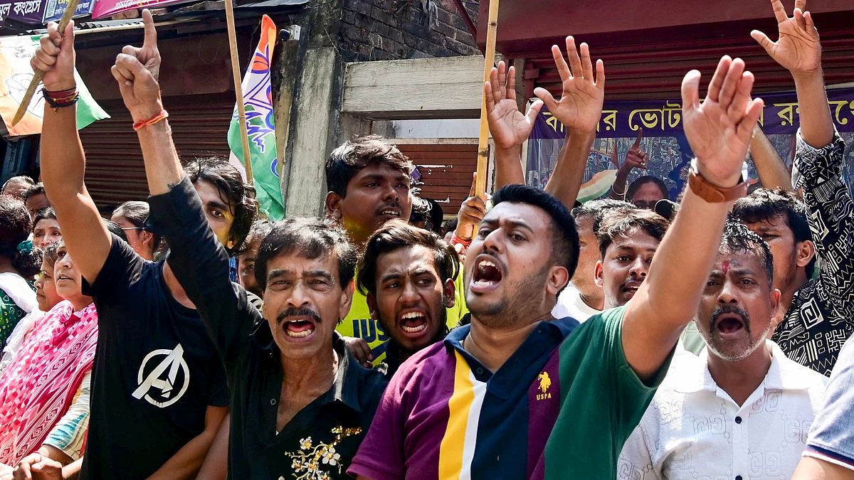 TMC supporters raise slogans during a roadshow led by Union home minister Amit Shah in Kolkata, 2 April