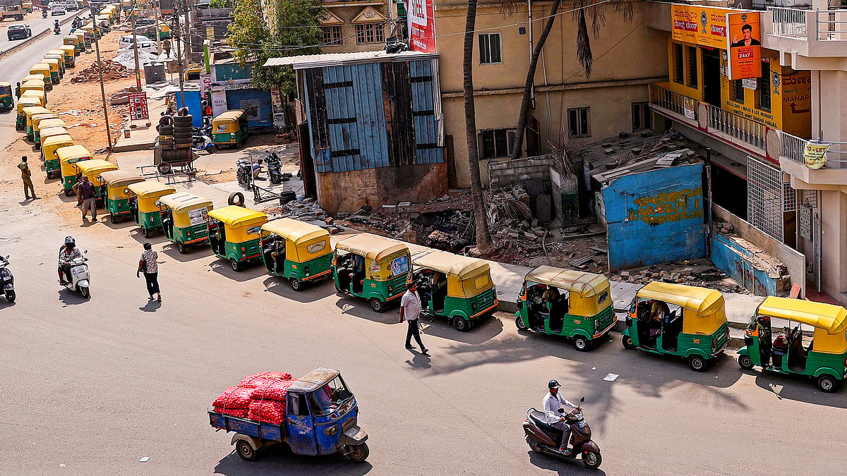 Auto-rickshaws queue up near a fuel station on Kanteerava Studio Main Road, Bengaluru, 3 April