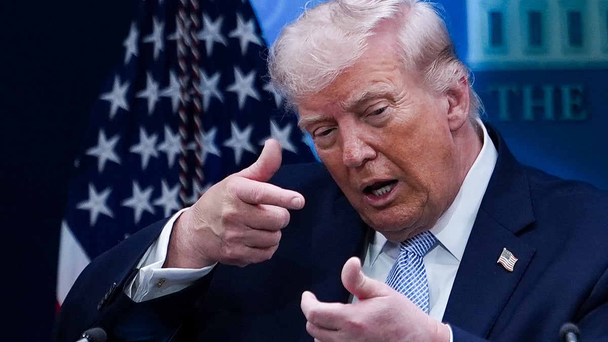 Donald Trump reacts during a press briefing at White House.