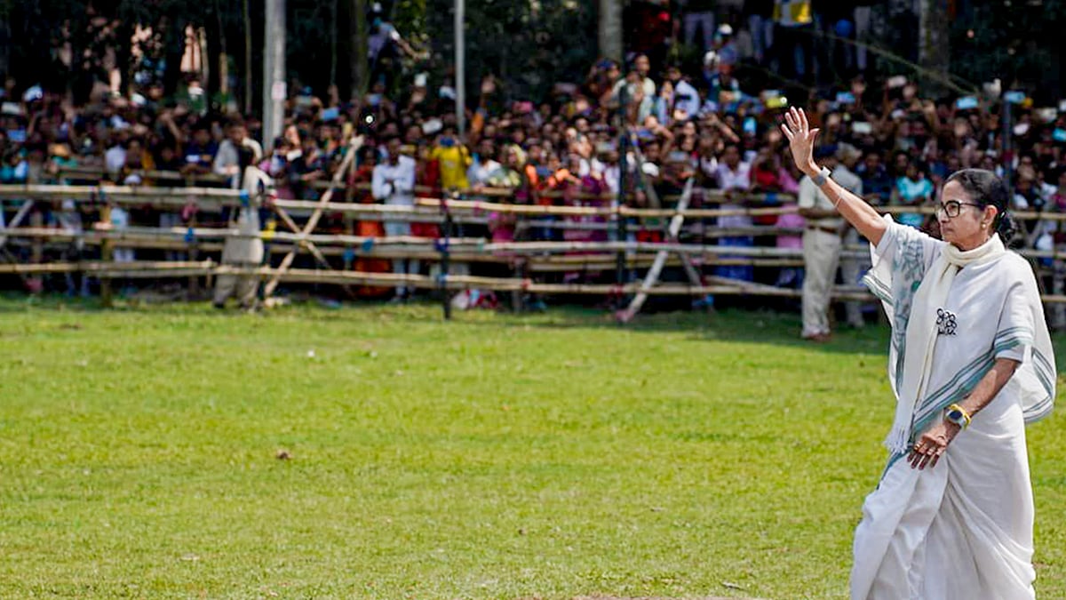 West Bengal Chief Minister Mamata Banerjee waves during a public meeting