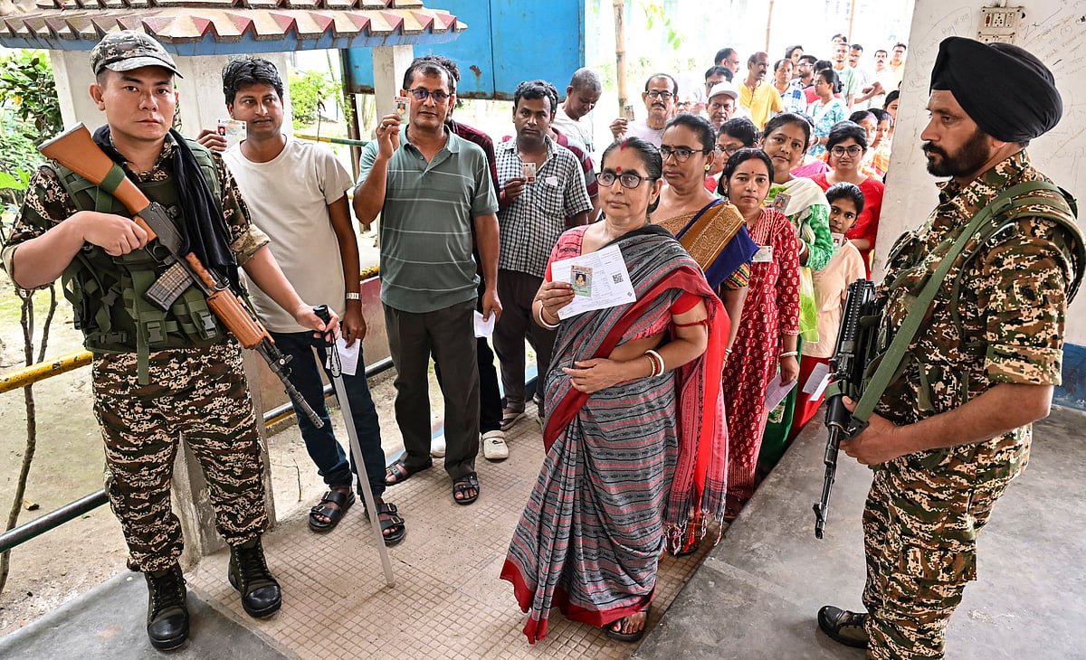Voting in the first phase of the West Bengal Assembly elections at a polling station in Malda