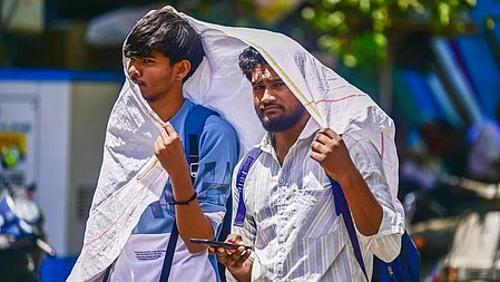 Two men cover themselves to stay protected from the heat