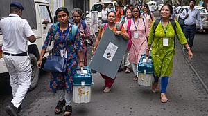 Polling officials leave for their booths with EVMs VVPAT units in Kolkata