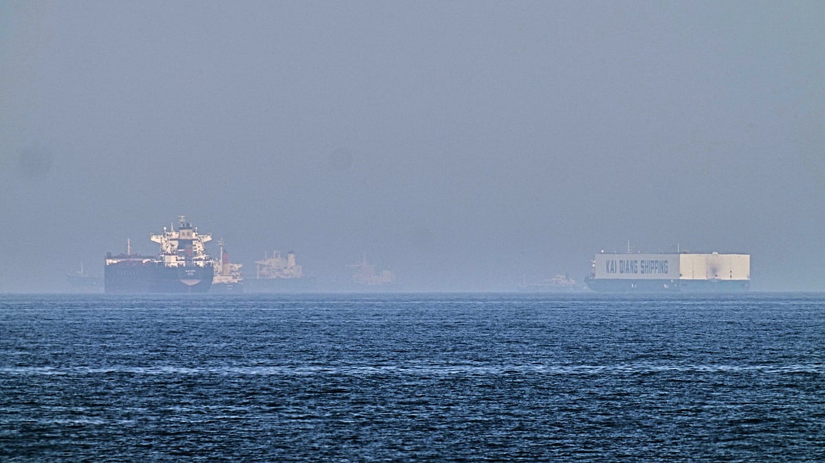 A tanker, left, and a car carrier are anchored at sea in Gulf of Oman near Strait of Hormuz.