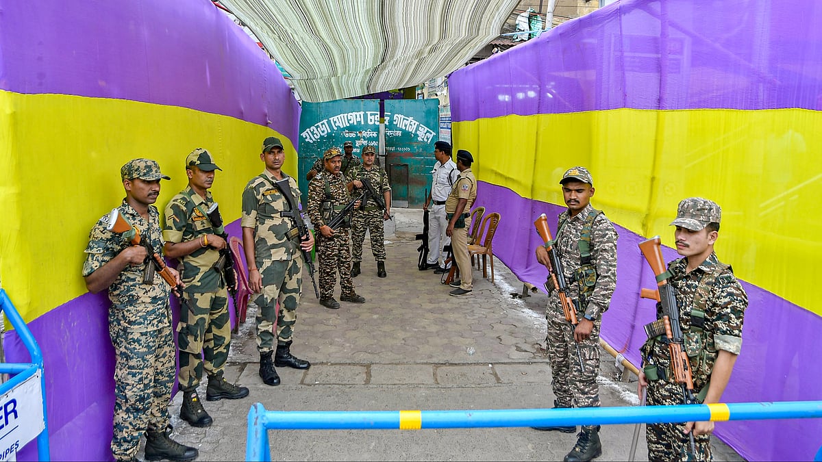 Security personnel stand guard outside a strong room in Howrah.