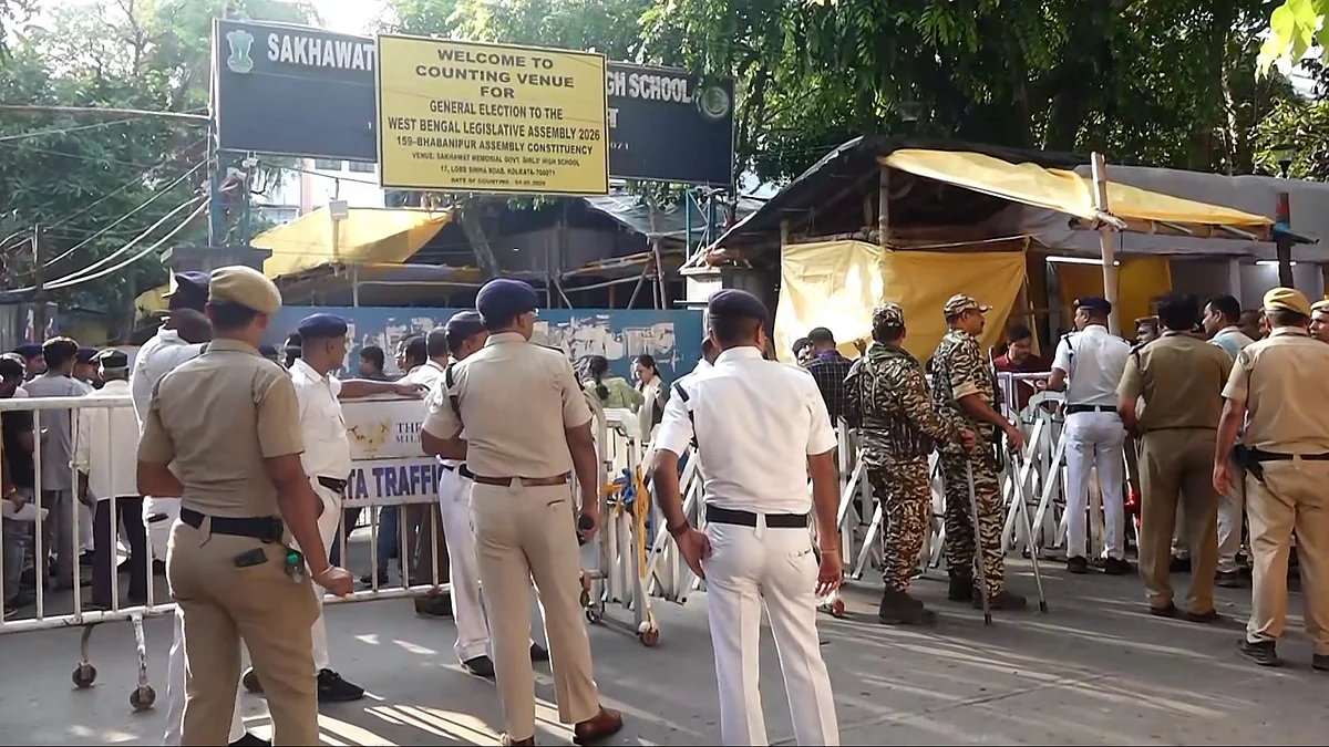 Security personnel and officials outside a vote counting centre in Kolkata.