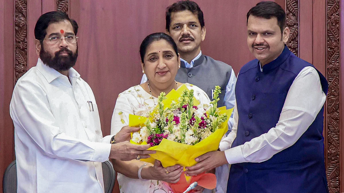 Devendra Fadnavis (R) and Eknath Shinde felicitate Sunetra Pawar after her bypoll win from Baramati