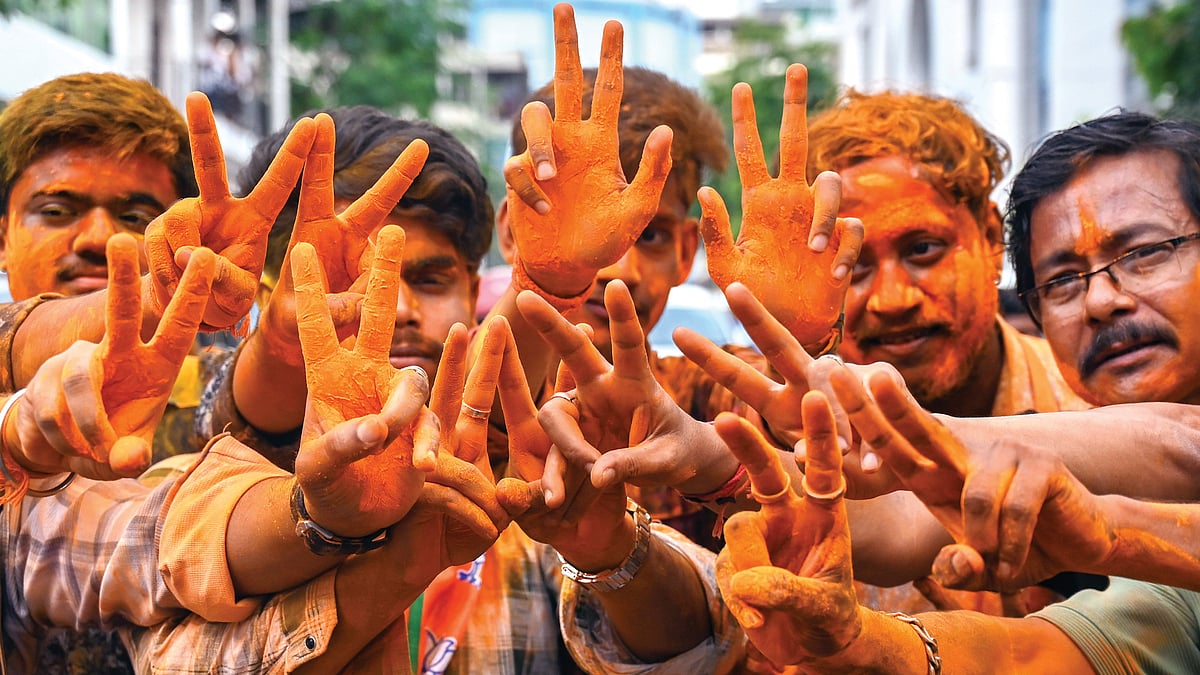 BJP workers in Kolkata celebrate the brute majority the party won on 4 May