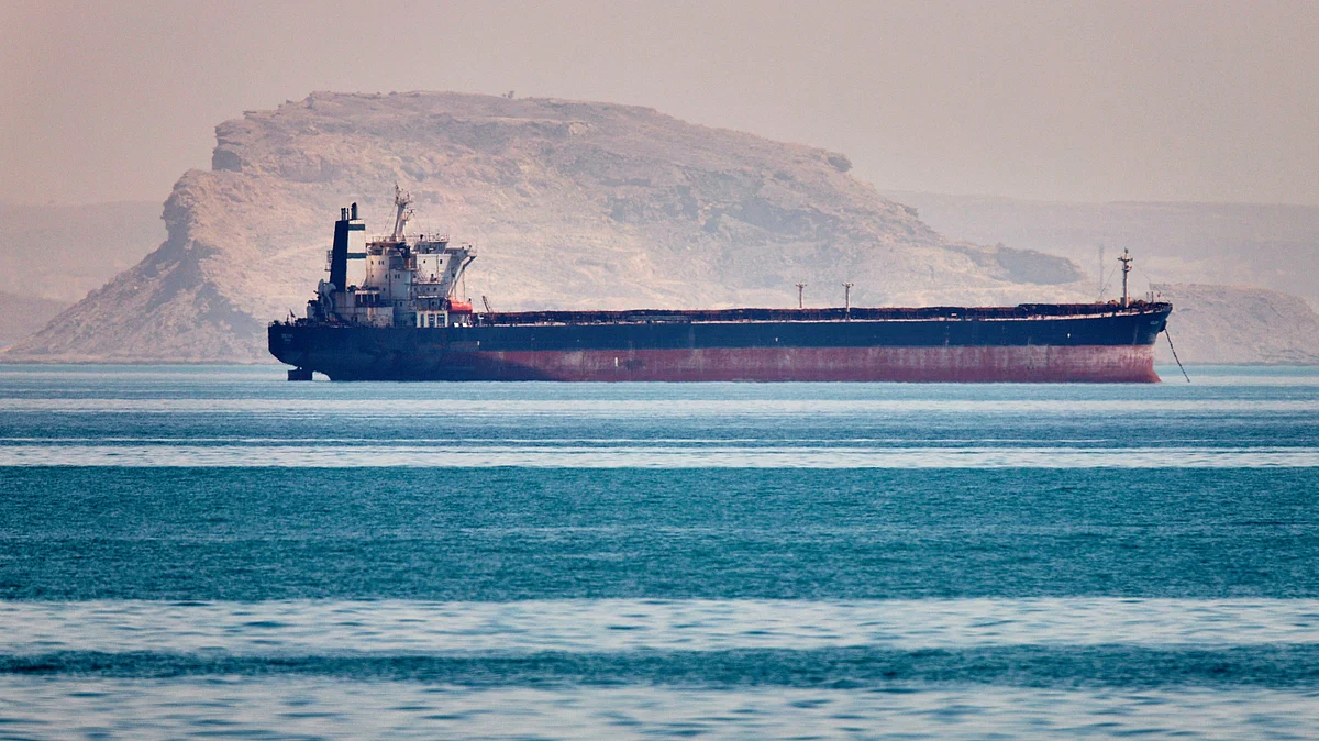 A bulk cargo ship sits at anchor in the Strait of Hormuz off Bandar Abbas, Iran, 2 May