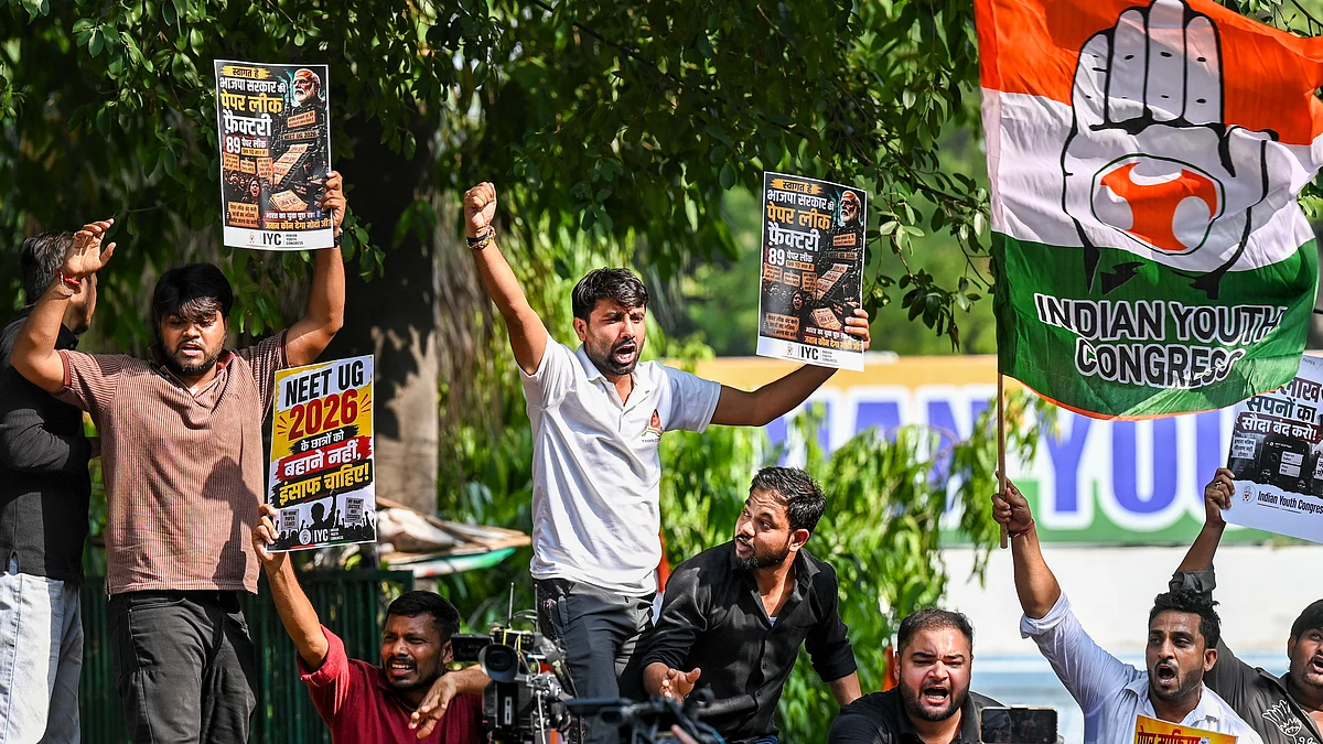 Congress activists raise slogans during a protest following the alleged leak of the NEET-UG 2026 paper.