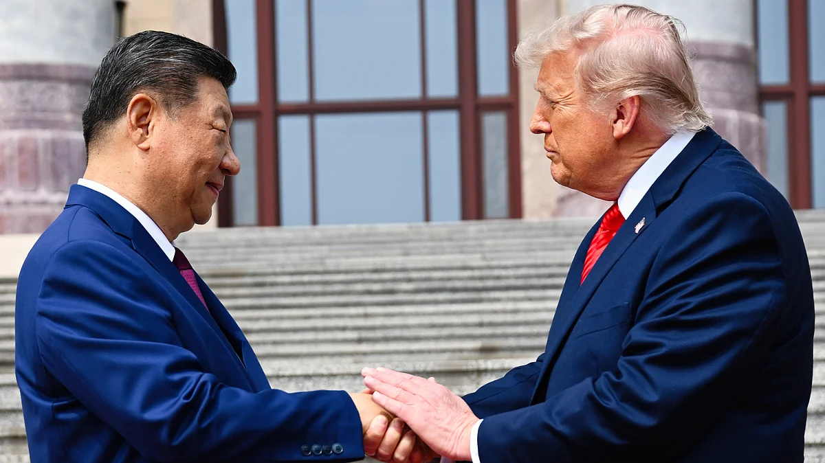 Xi Jinping shakes hands with Donald Trump at the Great Hall of the People in Beijing, 14 May