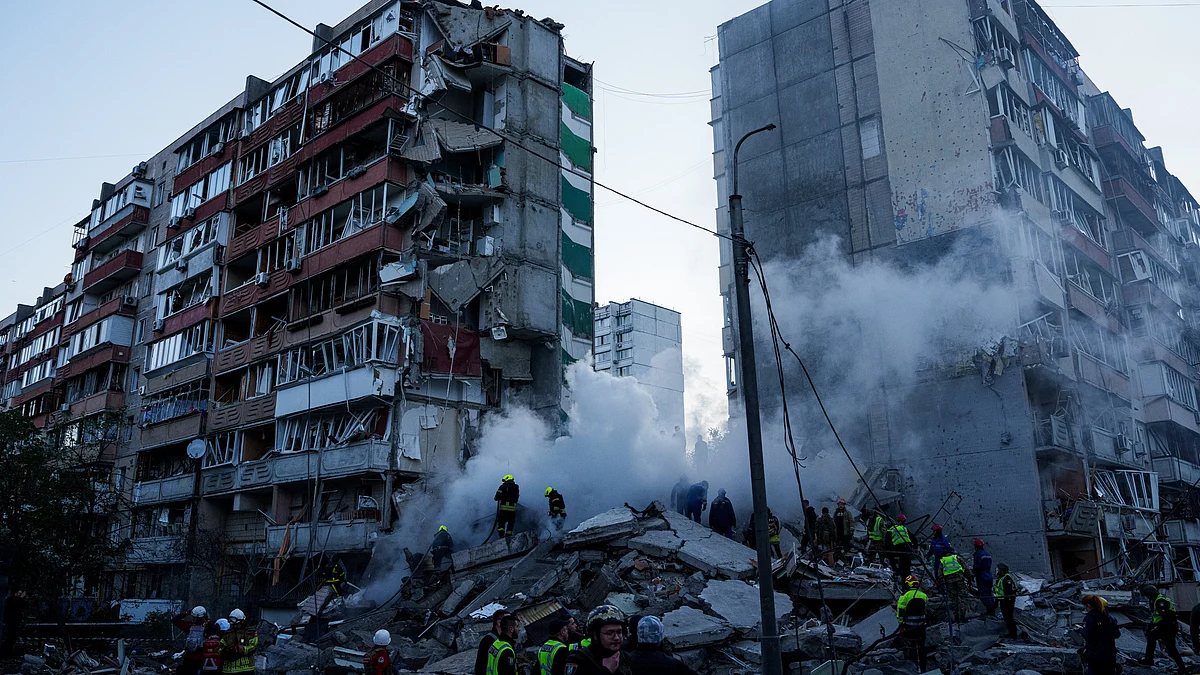 Rescue workers clear the rubble of a damaged house in Kyiv.
