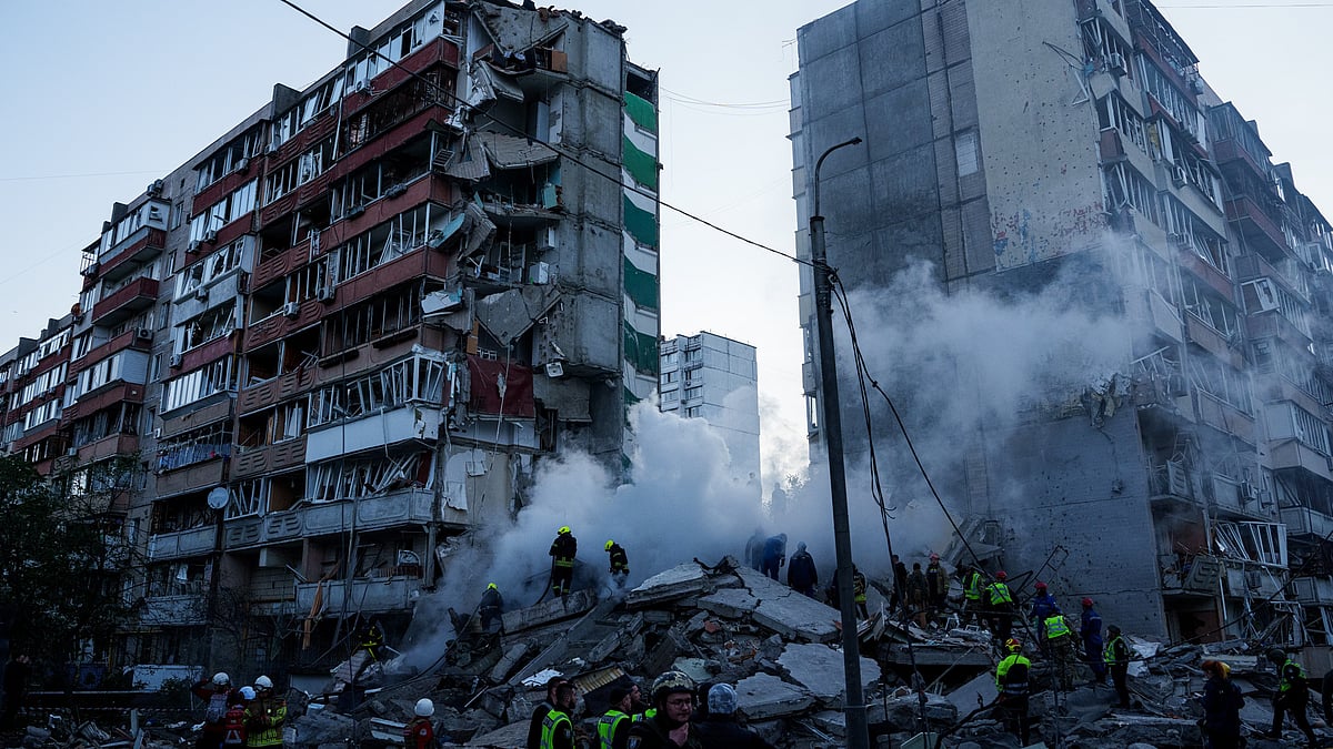 Rescue workers clear the rubble of a damaged house in Kyiv.