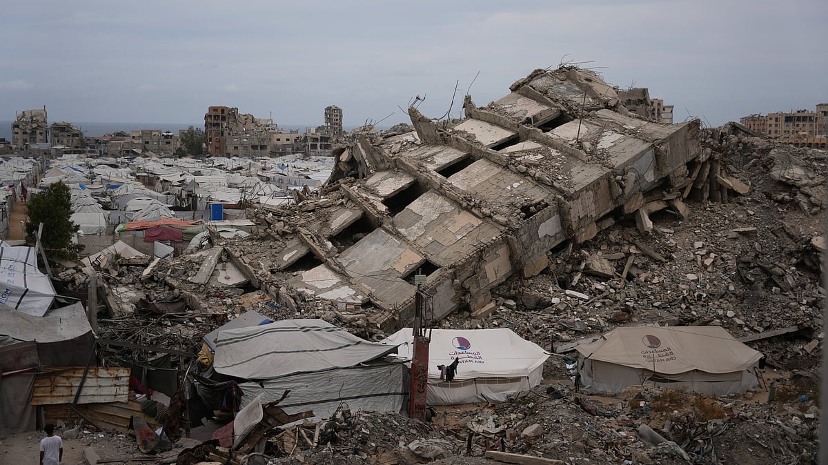 A sea of tents stands among shattered buildings in Gaza City.